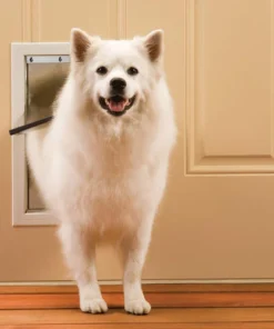 PetSafe® Freedom 8.25" X 12.25" Medium Premium White Aluminum Pet Door -Schlage Shop PPA00 10860FreedomAluminumPetDoorScene1
